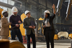 Factory owners talking about insurance and policy liability.